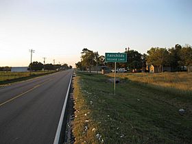 A Fairchilds sign on FM 361 looking northwest. Bits of cotton from the 2012 harvest lie along the roadside.
