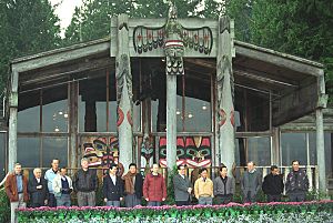 Photograph of President William Jefferson Clinton and Leaders of the Asia-Pacific Economic Cooperation (APEC) Standing Outside of the Tillicum Village Lodge on Blake Island in Seattle, Washington - NARA - 5720224