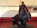 Woman riding mechanical bull