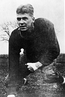 Ronald Reagan in football uniform on field at Eureka College in Eureka, Illinois