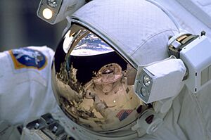 STS-103 Reflection on astronaut's visor