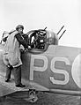 An air gunner of No. 264 Squadron RAF about to enter the gun turret of his Boulton Paul Defiant Mk I at Kirton-in-Lindsey, Lincolnshire, August 1940. CH874