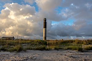 Oak Island Light with the clouds in the background