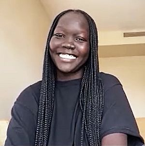 Nyakim Gatwech on Brad Show Live, smiling.jpg