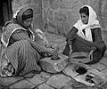 Palestinian women grinding coffee beans