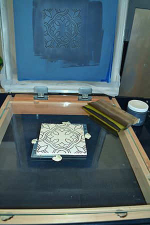 Picture showing silkscreen after black line squeegeed through and bisque tile now with 'dry cord' outline