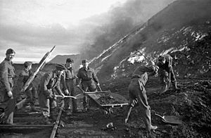 Royal Canadian Engineers sappers burning coal piles during Operation Gaunlet