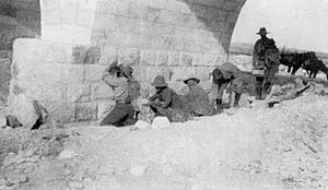 Soldiers laying gun cotton charges at the base of a pier of the Asluj bridge May 1917