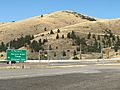Road sign at junction of US Route 93 and Montana Highway 200 at Ravalli, Montana