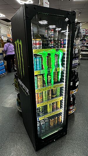 A Monster Energy drink refrigerator display unit inside Nisa Extra convenience shop on High Street, Gillingham