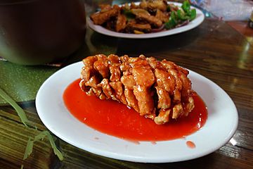 Deep fried fish in a sweet & sour sauce