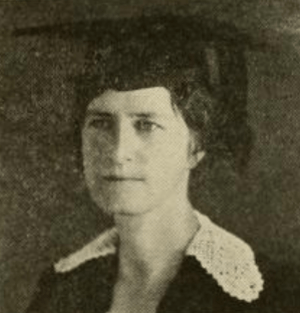 A white woman in academic robes and cap, from a 1921 yearbook