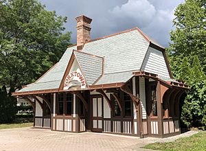 A small train station with Tudor Revival architecture