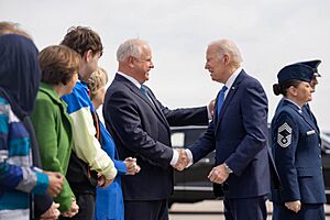 President Joe Biden greets Governor Tim Walz at Minneapolis-Saint Paul Joint Air Reserve Station in Minnesota