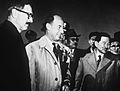 Stevenson and Korean officials at USAF base in Korea, March 1953