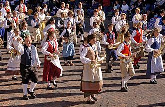 People wearing traditional Swedish-style clothing