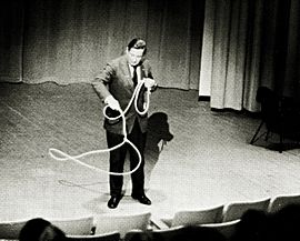 Will Rogers, Jr. showing lasso tricks at Alaska Methodist University