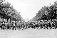 American troops march down the Champs Elysees