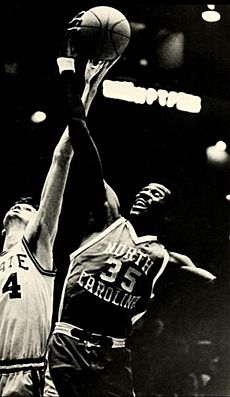 Bob McAdoo of the Buffalo Braves shoots over Elvin Hayes of the