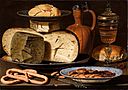 Clara Peeters - Still Life with Cheeses, Almonds and Pretzels.jpg