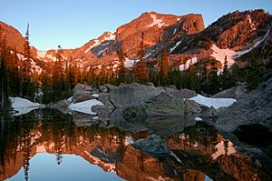 Hallet's Peak reflected in Lake Haiyaha at darn in Rocky Mountain National Park. NPS-Debra Miller (18659267056)
