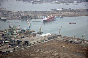 US Navy 110320-N-OB360-166 An aerial view of ships washed ashore and overturned at a port near the Japan Air Self-Defense Force Matsushima Air Base