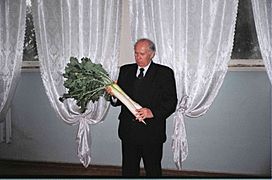 Vladimir Zuev (professor of TSAU) hold on daikon growing in Uzbekistan