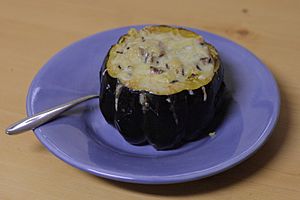 Acorn squash stuffed with pilaf and topped with cheese