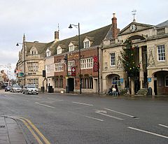 Historic town centre, showing the town hall (with traditional Christmas tree), Burghley Arms and Lloyds Bank, all Victorian rebuilds of medieval originals