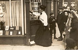 Mary Sinclair entering Kensington Women's Social & Political Union shop