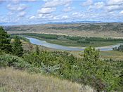 Left: Missouri River, Charles M. Russell National Wildlife Refuge. Right: Fort Peck Dam on Missouri River in Fort Peck, Montana