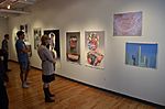 People looking at artwork inside the OCAD University Graduate Student Gallery