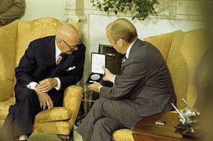 President Gerald R. Ford and President Urho Kekkonen of Finland Examining a Medal Kekkonen Presented to Ford in the Oval Office - NARA - 12007050