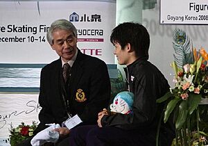 Takahiko Kozuka with Nobuo Sato kiss & cry 2008-2009 GPF