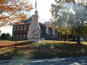 The "Whately Milk Bottle" in front of the old Whately Central School (built 1910)