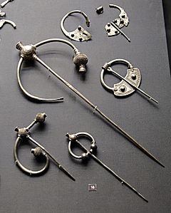 display of silver brooches, some broken up