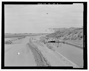 Context view, looking northeast along the Wellton Canal and access road at the Radial Gate Check. Antelope Hill is visible in the background - Wellton-Mohawk Irrigation System, Radial HAER AZ-68-E-1