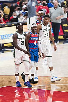 Jrue and Aaron Holiday with Giannis