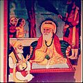 Painting of Guru Nanak seated under a tree in the presence of Bhai Bala, Bhai Mardana, and his two sons (Sri Chand and Lakhmi Das), by Gian Singh Naqqash