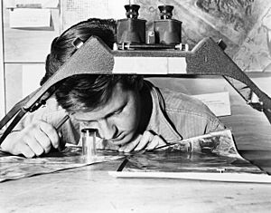 FIFTH AIR FORCE, KOREA-With a photograph of a Communist gun position in front of him, Sgt. James E. Kindseth moves... - NARA - 542277 - restored