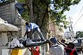 Haitians pull out a body from the rubbles of a school (12 january 2010)
