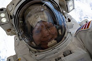 ISS-59 EVA-1 (p) Anne McClain takes a space-selfie