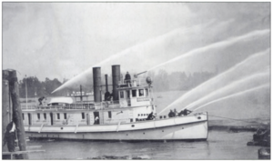 Portland, Oregon's first fireboat, the George H. Williams fights a fire in 1908