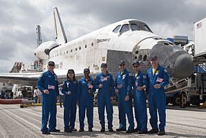 STS-131 Crew after landing in front of Discovery