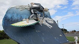 Big Surfer riding a wave Colac Bay
