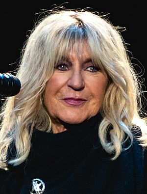A photo of McVie's face, standing in front of a microphone