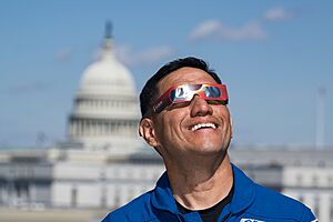 Expedition 69 Crew Wears Solar Eclipse Glasses (NHQ202403190040)