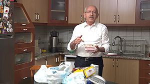 Kemal Kılıçdaroğlu in his kitchen with groceries