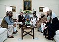 Reagan sitting with people from the Afghanistan-Pakistan region in February 1983