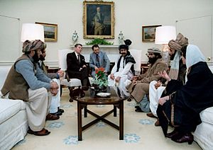 Reagan sitting with people from the Afghanistan-Pakistan region in February 1983